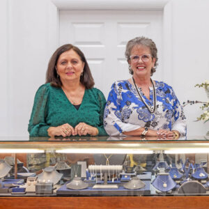 Two women by jewelry case